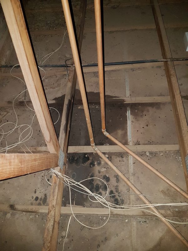 Leaking hot water pipe 22mm copper pipe burst inside the ceiling