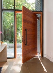 Pivotal door installation. Aluminium or wooden door installed by Carpenter