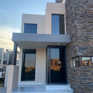 Window Tint Installation or Window Tinting by application of window film on House windows and doors for Privacy